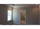 Bedroom with ensuite bathroom and neutral color palette at 1410 Reading Ct # 92Kl, Burlington, NC 27217
