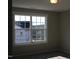 Bedroom with a large window and backyard view at 1410 Reading Ct # 92Kl, Burlington, NC 27217
