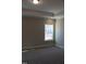 Bright bedroom with carpeted floor, large window and neutral walls at 1410 Reading Ct # 92Kl, Burlington, NC 27217
