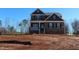 Two-story brick home with front porch and attached garage at 1410 Reading Ct # 92Kl, Burlington, NC 27217