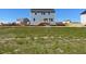 The home features a backyard with a small wooden deck, and a light blue siding at 157 Grove Township Way, Angier, NC 27501