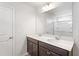 Bright bathroom featuring a double vanity with modern fixtures and a large mirror above at 157 Grove Township Way, Angier, NC 27501