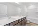 Well-lit bathroom with a double vanity, modern fixtures, and clean, stylish design at 157 Grove Township Way, Angier, NC 27501