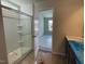 Well-lit bathroom with a tiled shower and vanity at 157 Grove Township Way, Angier, NC 27501