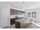 Bright kitchen showcasing stainless steel appliances, granite countertops, and modern fixtures at 157 Grove Township Way, Angier, NC 27501