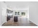 Modern kitchen featuring stainless steel appliances, dark cabinetry, and an island with a granite countertop at 157 Grove Township Way, Angier, NC 27501