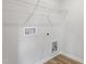 Well-lit laundry room with hookups and shelving, perfect for a functional space at 157 Grove Township Way, Angier, NC 27501