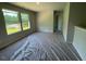 Bright living room featuring large windows and an open-concept layout at 157 Grove Township Way, Angier, NC 27501