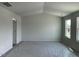 Spacious living room featuring large windows for natural light at 157 Grove Township Way, Angier, NC 27501