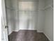 Walk-in closet featuring ample space and hanging racks at 157 Grove Township Way, Angier, NC 27501