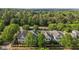 An aerial view showing manicured lawns, mature trees, and charming neighborhood at 1703 Happiness Hill Ln, Raleigh, NC 27614
