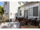 The brick back patio features an exterior door, stairs, mirror and covered appliances at 1703 Happiness Hill Ln, Raleigh, NC 27614