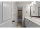 Bright bathroom featuring a double sink vanity and a shower/tub combo at 1703 Happiness Hill Ln, Raleigh, NC 27614