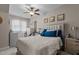 Bright bedroom with natural light, plush carpeting, and modern decor at 1703 Happiness Hill Ln, Raleigh, NC 27614