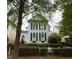 Charming two-story home featuring blue shutters and a well-manicured lawn with a white picket fence at 1703 Happiness Hill Ln, Raleigh, NC 27614