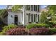 Attractive two-story home with blue shutters, arched windows, and well-maintained landscaping at 1703 Happiness Hill Ln, Raleigh, NC 27614
