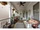 Relaxing front porch featuring comfortable seating, decorative accents, and hanging plants at 1703 Happiness Hill Ln, Raleigh, NC 27614