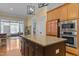 Open kitchen design with stainless steel appliances and island with seating at 1703 Happiness Hill Ln, Raleigh, NC 27614
