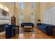 Spacious living room with high ceilings, fireplace, and comfortable seating arrangement at 1703 Happiness Hill Ln, Raleigh, NC 27614