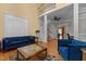 Bright living room with hardwood floors, stylish seating, and two-story ceilings at 1703 Happiness Hill Ln, Raleigh, NC 27614