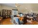 Well-lit office with built-in shelving, hardwood floors and modern decor at 1703 Happiness Hill Ln, Raleigh, NC 27614