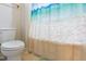 Bathroom featuring a modern toilet and patterned shower curtain at 1726 Rapids Ct, Franklinton, NC 27525
