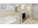 Elegant bathroom with a soaking tub, double vanity and a separate toilet area at 1726 Rapids Ct, Franklinton, NC 27525