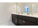 Bathroom featuring double vanity with modern fixtures and vanity cabinets for ample storage at 1726 Rapids Ct, Franklinton, NC 27525