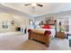 Spacious bedroom with carpet, natural light, and a tray ceiling at 1726 Rapids Ct, Franklinton, NC 27525
