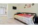 Comfortable bedroom with natural light streaming through the window, complemented by decor at 1726 Rapids Ct, Franklinton, NC 27525