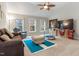 Spacious bonus room with vaulted ceiling, comfortable seating, and a ceiling fan at 1726 Rapids Ct, Franklinton, NC 27525