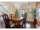 Formal dining room with hardwood floors, a chandelier, and a large window at 1726 Rapids Ct, Franklinton, NC 27525