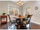 Charming dining room with hardwood floors and a view of the backyard at 1726 Rapids Ct, Franklinton, NC 27525