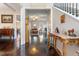 Entryway with hardwood floors, console table, and view into the living room and dining area at 1726 Rapids Ct, Franklinton, NC 27525