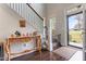 Entryway with hardwood floors, console table, and a view of the living room at 1726 Rapids Ct, Franklinton, NC 27525