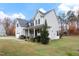 Two story house with a large yard, attached garage and front porch at 1726 Rapids Ct, Franklinton, NC 27525