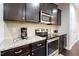Modern kitchen with granite countertops and stainless steel appliances at 1726 Rapids Ct, Franklinton, NC 27525