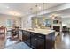 Open concept kitchen with large island, granite countertops and stainless steel appliances at 1726 Rapids Ct, Franklinton, NC 27525