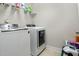 Laundry room with washer, dryer, and shelving at 1726 Rapids Ct, Franklinton, NC 27525