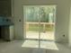 Kitchen view leading to an outdoor deck with a sliding glass door at 173 Grove Township Way, Angier, NC 27501