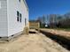 The backyard has a wooden deck and a view of new home construction at 173 Grove Township Way, Angier, NC 27501