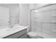 Clean bathroom with a glass enclosed shower and light grey vanity at 173 Grove Township Way, Angier, NC 27501