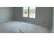 A bedroom with two windows providing ample natural light at 173 Grove Township Way, Angier, NC 27501
