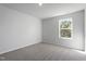 Carpeted bedroom with a window offering natural light at 173 Grove Township Way, Angier, NC 27501