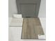 Gray kitchen cabinet with tile and vinyl flooring samples at 173 Grove Township Way, Angier, NC 27501