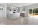 Modern kitchen with gray cabinets, stainless steel appliances, subway tile backsplash, and a center island at 173 Grove Township Way, Angier, NC 27501