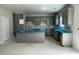 Open concept kitchen with gray cabinets, island, and space for dining at 173 Grove Township Way, Angier, NC 27501