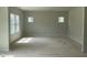 Large open living room space with multiple windows providing ample natural light at 173 Grove Township Way, Angier, NC 27501