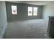 Spacious living room featuring three large windows, ready for your personal touch at 173 Grove Township Way, Angier, NC 27501