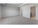 Main bedroom boasts neutral colors, plush carpeting, and ensuite access at 173 Grove Township Way, Angier, NC 27501